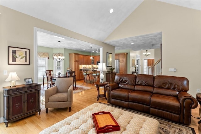 89 Cortland Dr Unit 89, North Andover, MA 01845 - living area featuring a chandelier, light wood-style floors, stairs, high vaulted ceiling, and recessed lighting