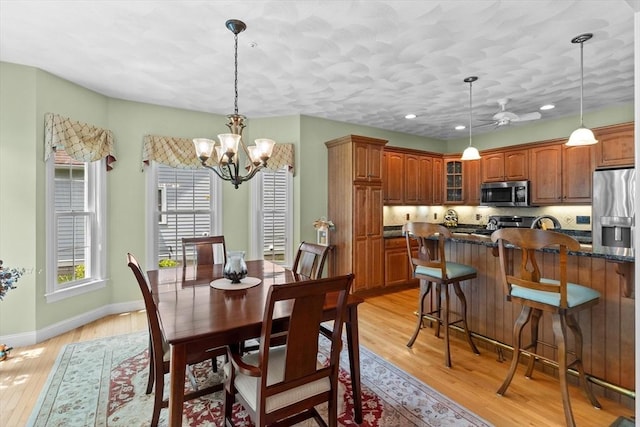 89 Cortland Dr Unit 89, North Andover, MA 01845 - dining room with light wood-style floors, a chandelier, baseboards, and recessed lighting