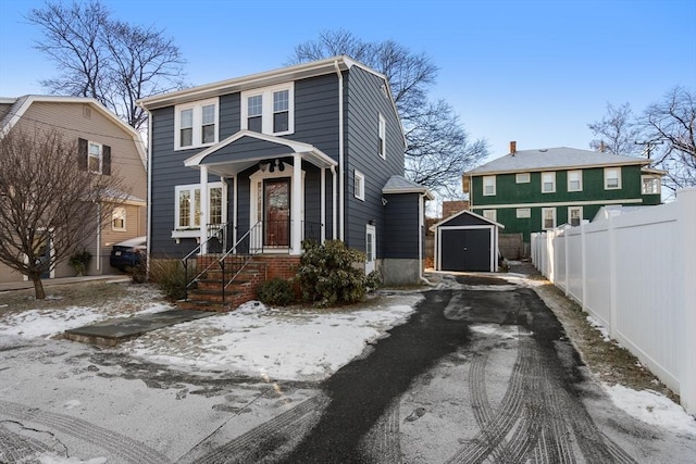 view of front of home featuring a storage shed