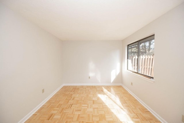 spare room featuring baseboards