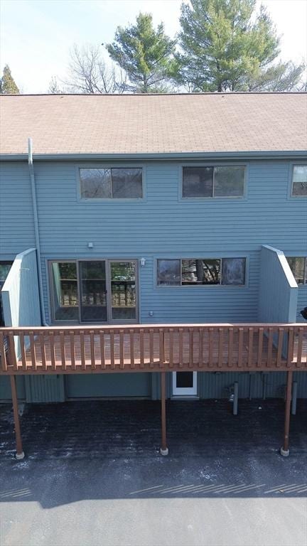 back of house featuring a deck