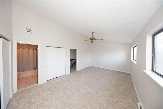 unfurnished bedroom with light colored carpet, visible vents, and baseboards