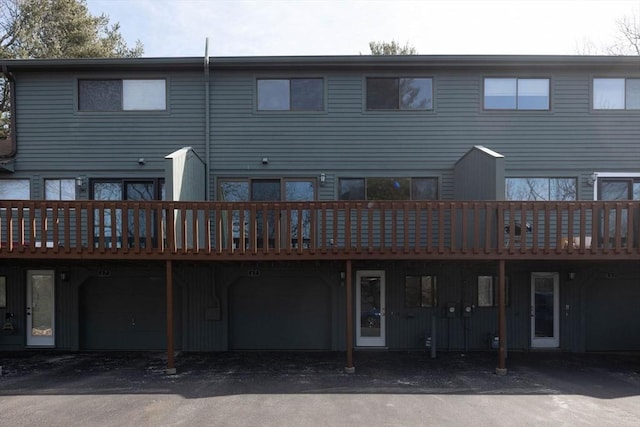 rear view of house featuring a deck