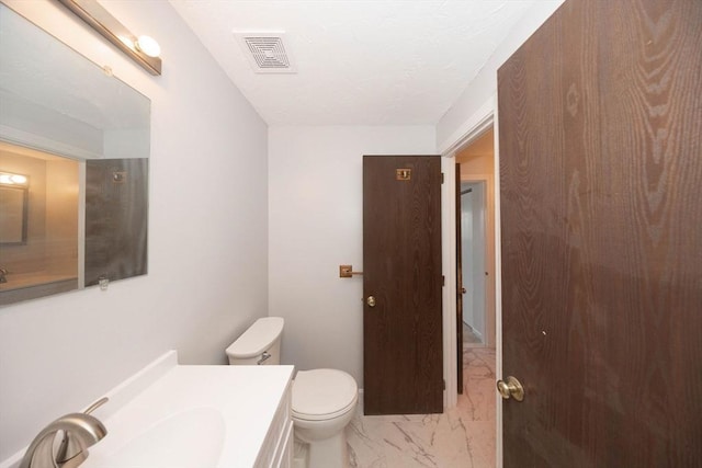 half bath with visible vents, toilet, marble finish floor, and vanity