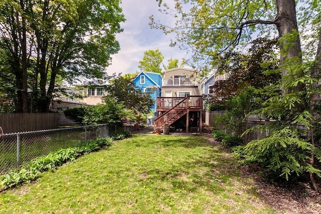 view of yard featuring stairs and a deck