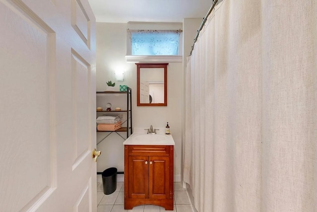 bathroom with tile patterned floors and vanity
