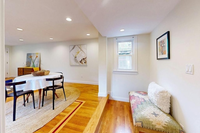 dining room with light wood-style floors, baseboards, and recessed lighting