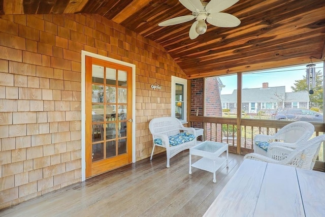 sunroom / solarium with vaulted ceiling and ceiling fan