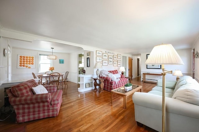 living room with wood finished floors and baseboard heating
