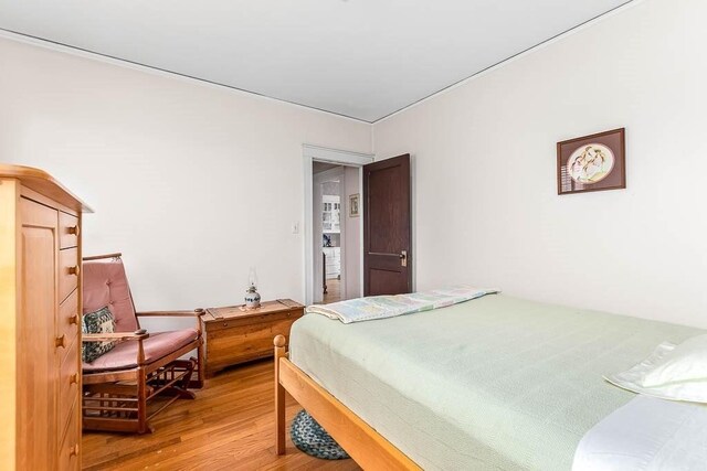 86 Glencoe St Unit 86, Boston, MA 02135 - bedroom featuring light wood-style floors