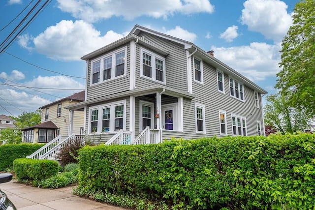 86 Glencoe St Unit 86, Boston, MA 02135 - view of front of house featuring a chimney