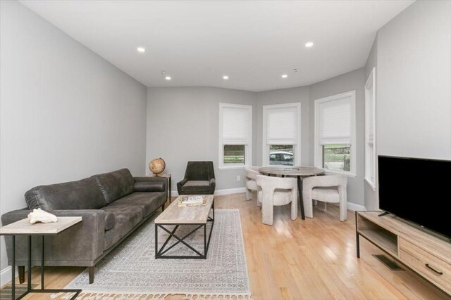 755 Boylston St Unit 1, Brookline, MA 02467 - living area with plenty of natural light, wood finished floors, recessed lighting, and baseboards
