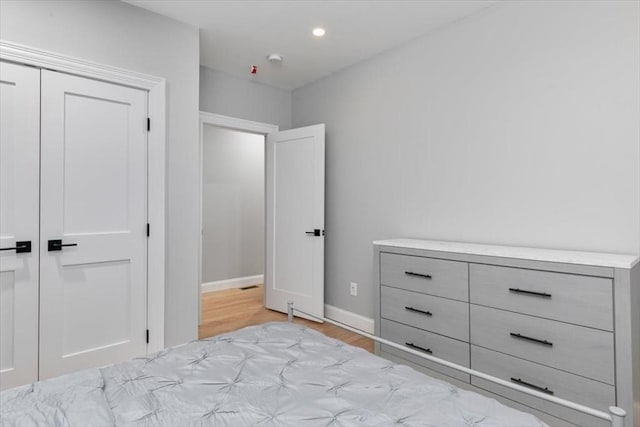 755 Boylston St Unit 1, Brookline, MA 02467 - bedroom featuring light wood-style floors, baseboards, a closet, and recessed lighting