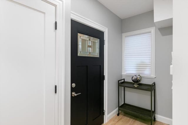 755 Boylston St Unit 1, Brookline, MA 02467 - foyer entrance featuring light wood-style floors and baseboards