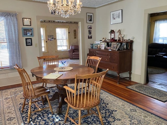 98 Mechanic St, Orange, MA 01364 - dining area featuring wood finished floors, crown molding, and a chandelier
