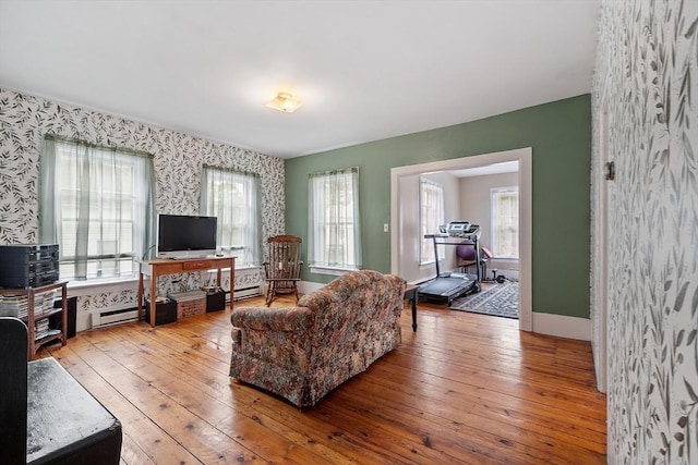 98 Mechanic St, Orange, MA 01364 - living room featuring wallpapered walls, hardwood / wood-style floors, a baseboard heating unit, and an office area