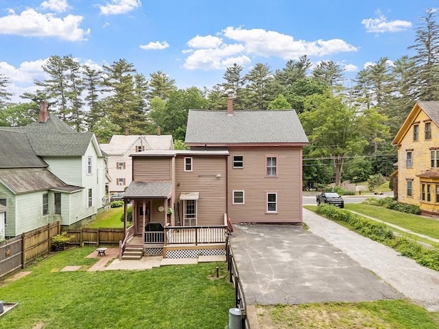 98 Mechanic St, Orange, MA 01364 - back of property with a wooden deck, a shingled roof, and a residential view