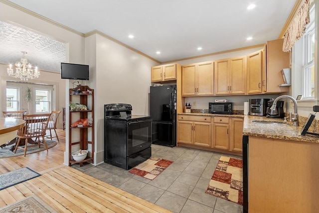 98 Mechanic St, Orange, MA 01364 - kitchen with black appliances, light brown cabinetry, ornamental molding, light stone counters, and a chandelier