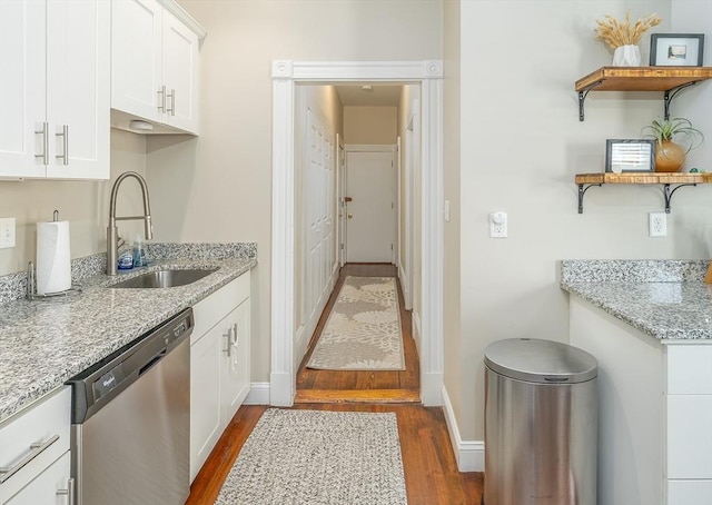646 E 7th St Unit 1, Boston, MA 02127 - kitchen featuring stainless steel dishwasher, dark wood-style floors, open shelves, white cabinetry, and light stone counters