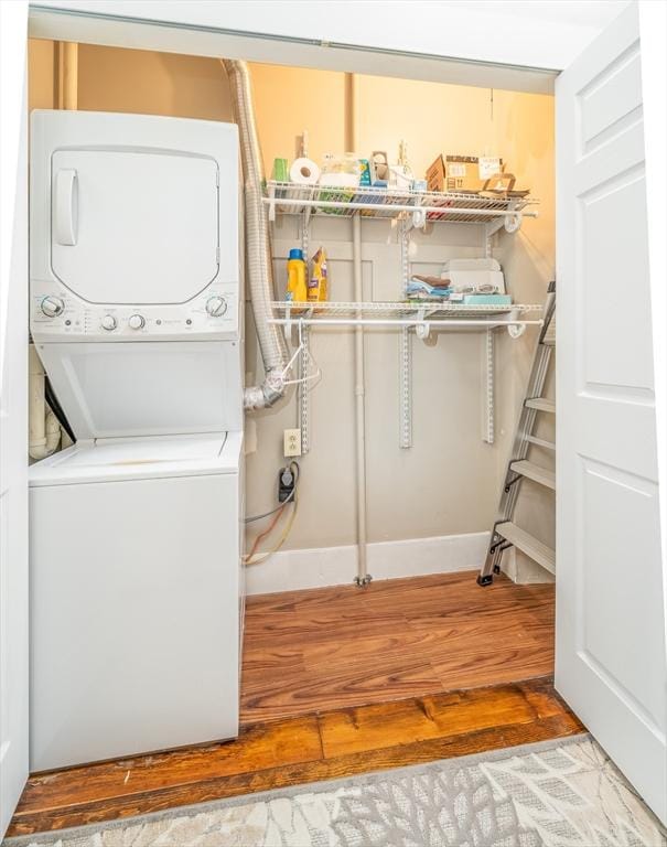 646 E 7th St Unit 1, Boston, MA 02127 - laundry area featuring estacked washer and dryer and wood finished floors
