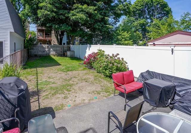 646 E 7th St Unit 1, Boston, MA 02127 - fenced backyard featuring grilling area and a patio