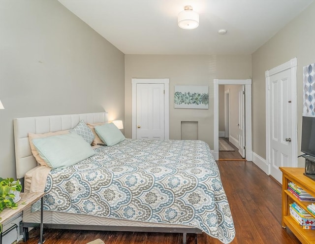 646 E 7th St Unit 1, Boston, MA 02127 - bedroom with dark wood-type flooring and baseboards