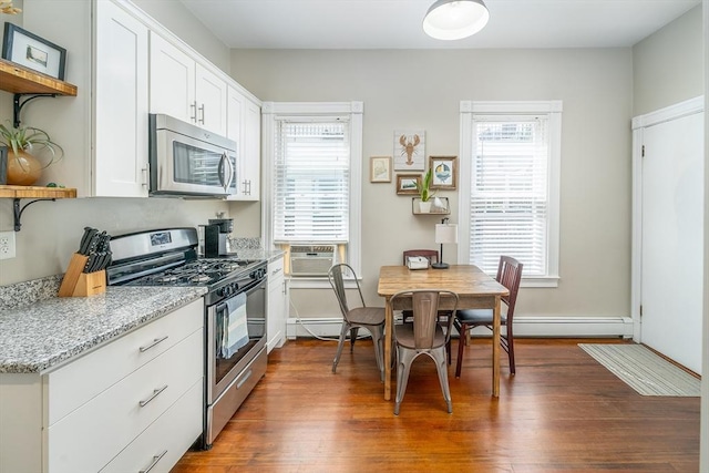 646 E 7th St Unit 1, Boston, MA 02127 - kitchen featuring stainless steel appliances, open shelves, dark wood-style flooring, and healthy amount of natural light