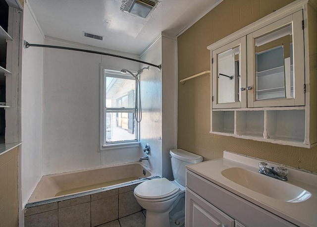 full bathroom featuring vanity, tiled shower / bath combo, and toilet