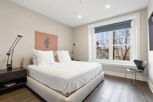 bedroom with recessed lighting, baseboards, and wood-type flooring