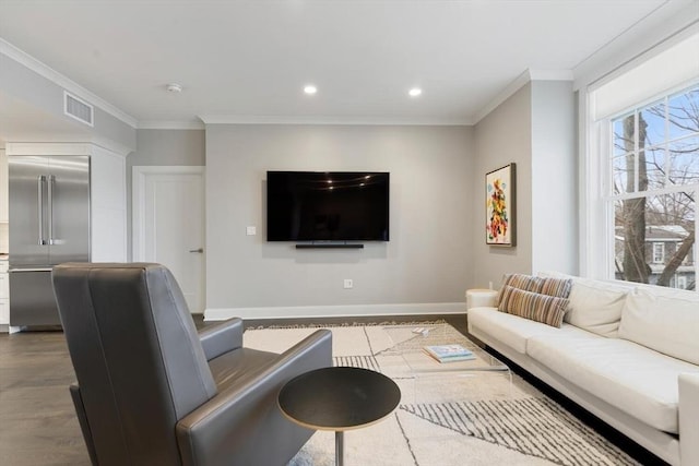 living area with visible vents, crown molding, baseboards, recessed lighting, and wood finished floors