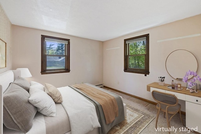 62 Brook St, Wakefield, MA 01880 - carpeted bedroom featuring a baseboard radiator and baseboards