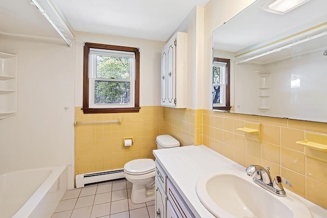 62 Brook St, Wakefield, MA 01880 - full bath featuring a baseboard radiator, tile patterned flooring, vanity, tile walls, and toilet