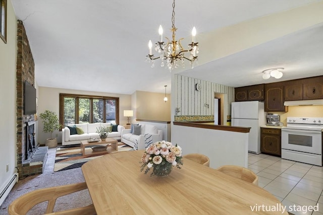 62 Brook St, Wakefield, MA 01880 - dining space featuring baseboard heating, a chandelier, light tile patterned flooring, and lofted ceiling