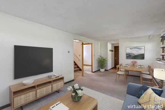 62 Brook St, Wakefield, MA 01880 - living area featuring stairs, carpet flooring, and baseboards