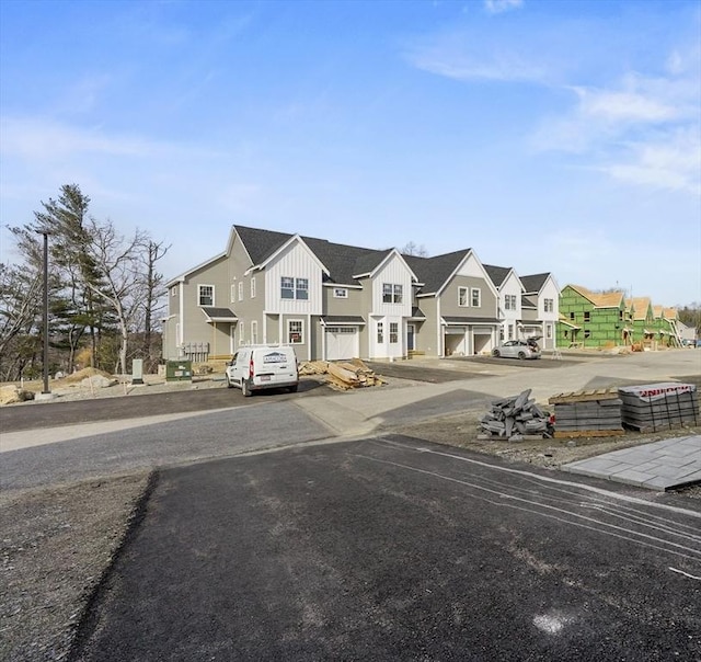 view of front of home featuring board and batten siding and a residential view