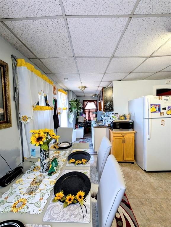 dining room with a drop ceiling