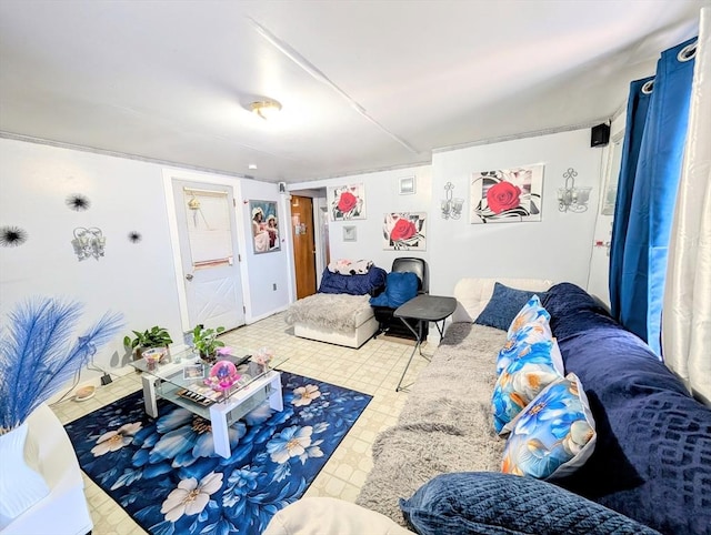 living area with tile patterned floors