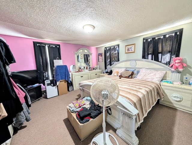 carpeted bedroom with a textured ceiling