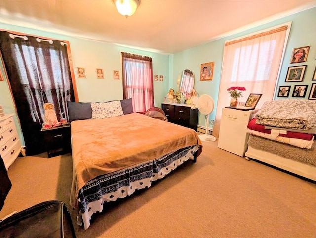 carpeted bedroom featuring a baseboard radiator