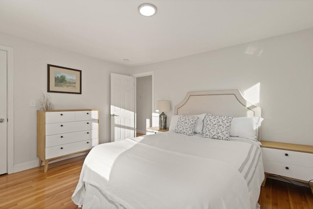 bedroom with light hardwood / wood-style flooring