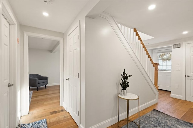 corridor featuring light hardwood / wood-style floors