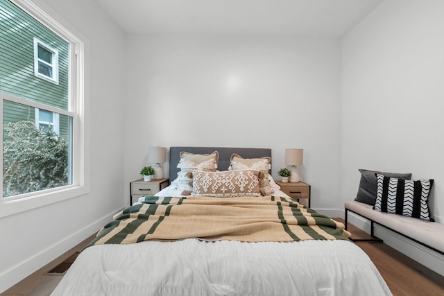 bedroom featuring dark hardwood / wood-style flooring