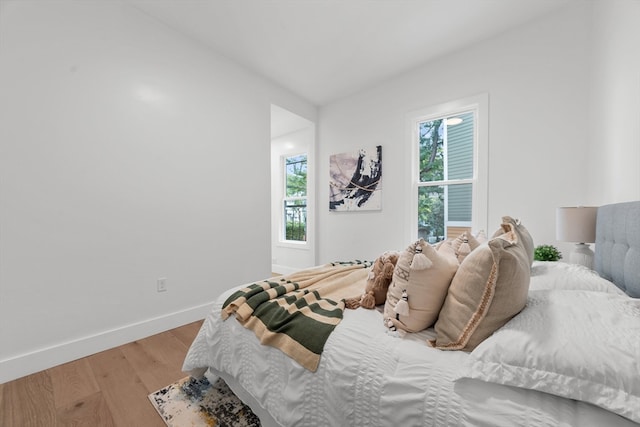 bedroom with light wood-type flooring