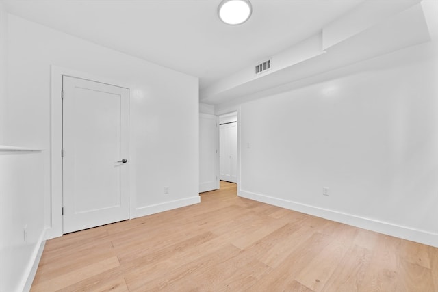 empty room with light wood-type flooring