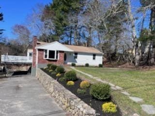 19 Fresh Pond Cir, Plymouth, MA 02360 - view of front facade featuring a front lawn, driveway, and a carport