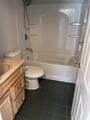 19 Fresh Pond Cir, Plymouth, MA 02360 - bathroom with toilet, vanity, and bathtub / shower combination