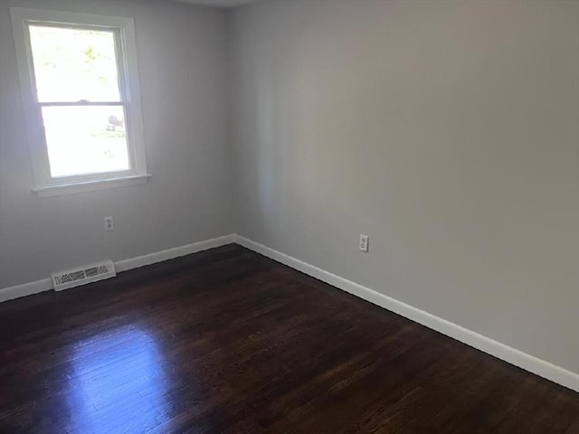 19 Fresh Pond Cir, Plymouth, MA 02360 - empty room with healthy amount of natural light, dark wood-type flooring, and baseboards