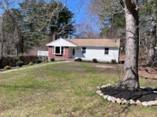 19 Fresh Pond Cir, Plymouth, MA 02360 - view of front of house with a front lawn and a chimney