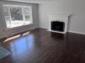 19 Fresh Pond Cir, Plymouth, MA 02360 - unfurnished living room featuring baseboards and a fireplace