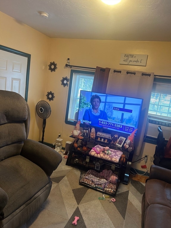 carpeted living room featuring cooling unit